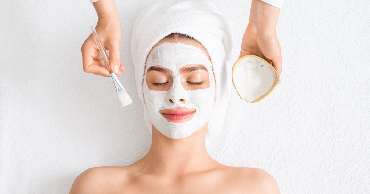 Woman enjoying a facial skin treatment in Mandeville, LA, lying with a mask applied